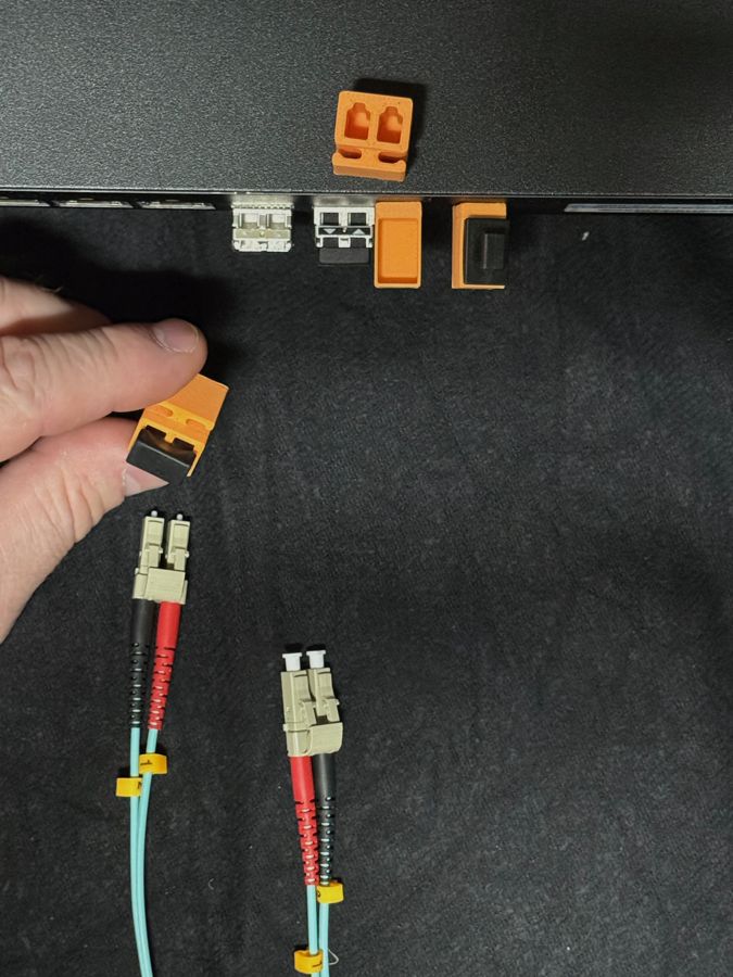 DuCSec holding the bundled dust caps